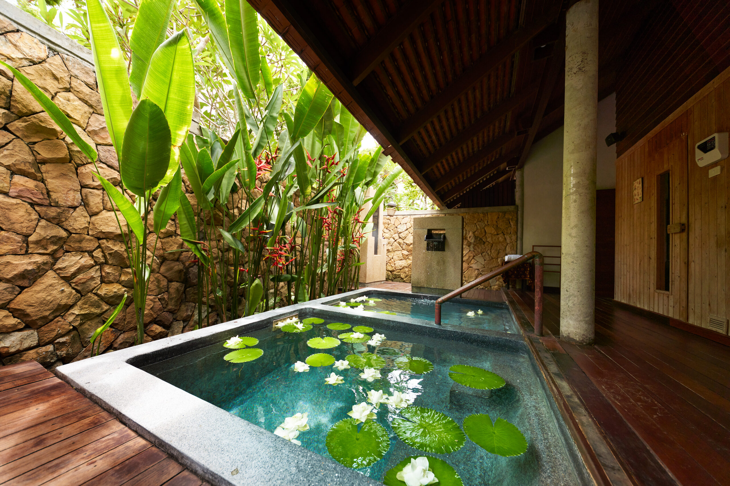 Private outdoor spa area with lily pads at The Tubkaak Krabi