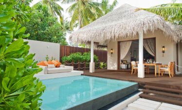 Private pool and patio at Ayada Maldives surrounded by lush greenery and tropical plants