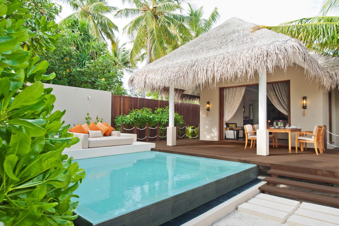 Private pool and patio at Ayada Maldives surrounded by lush greenery and tropical plants