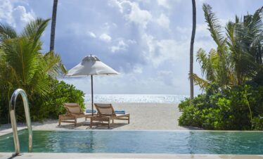 Private pool and sun loungers at Jawakara Dheru Island villa with ocean view