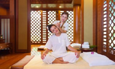 Relaxing spa session at Diamond Cliff Resort with traditional wooden decor and natural light