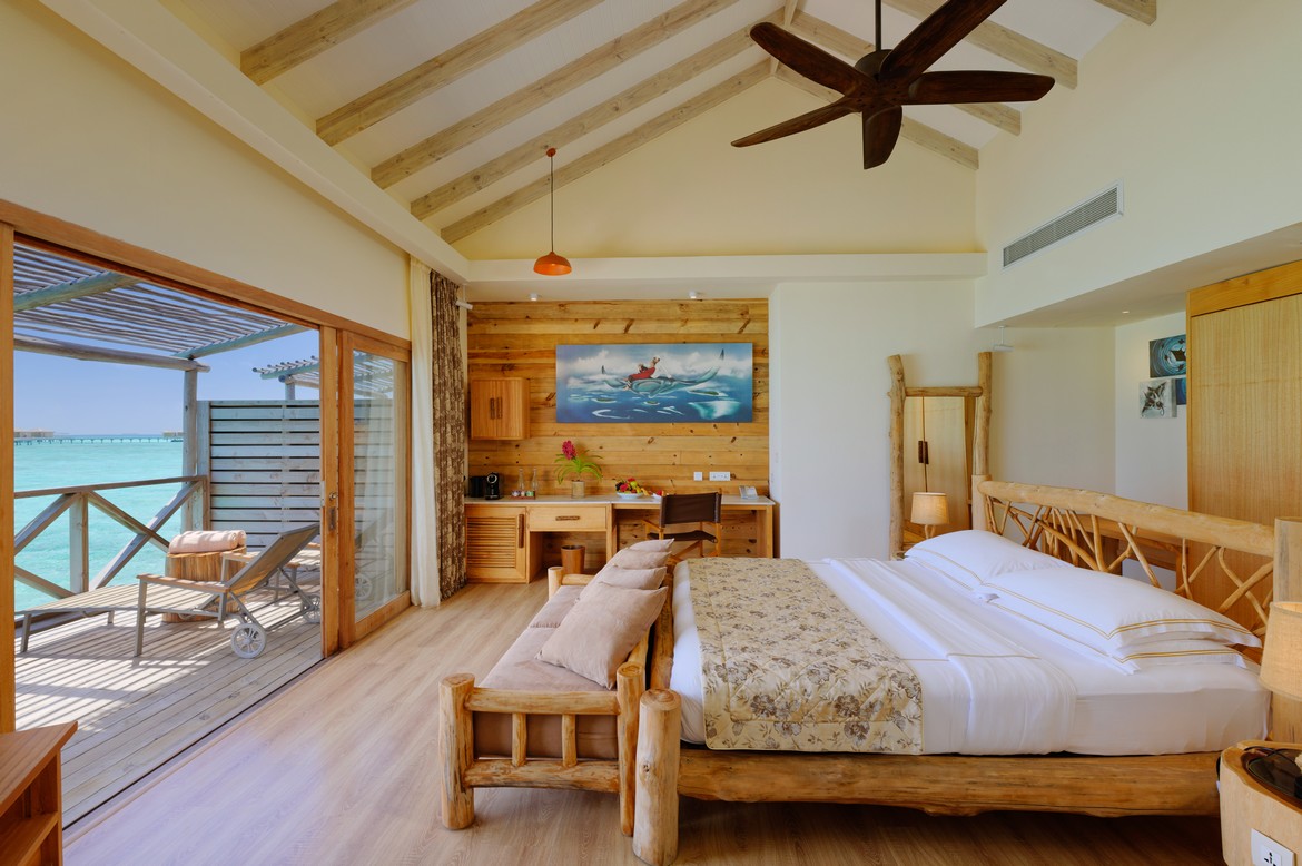 Spacious bedroom at You and Me by Cocoon overwater villa with balcony ocean view