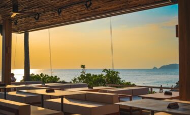 Sunset view from the dining area at Diamond Cliff Resort overlooking the calm ocean