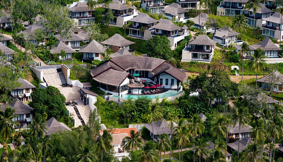 Villas and central pool area surrounded by greenery at The Vijitt Resort