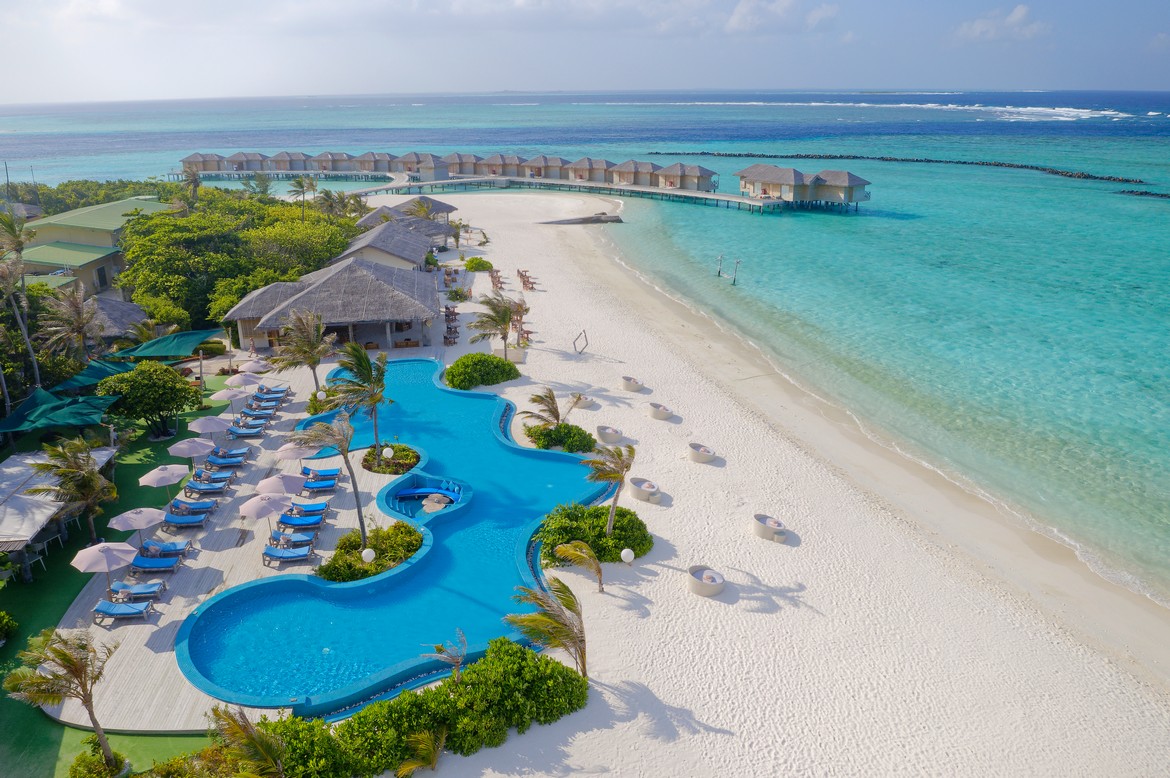 You and Me by Cocoon resort pool and beach area with overwater villas in view
