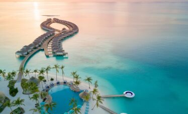 Aerial view of Kandima overwater villas and sunset lagoon