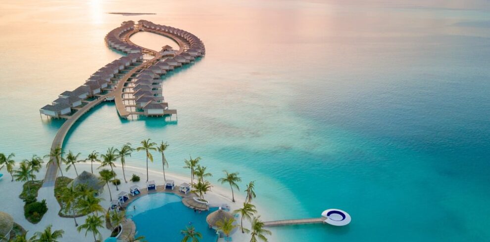 Aerial view of Kandima overwater villas and sunset lagoon