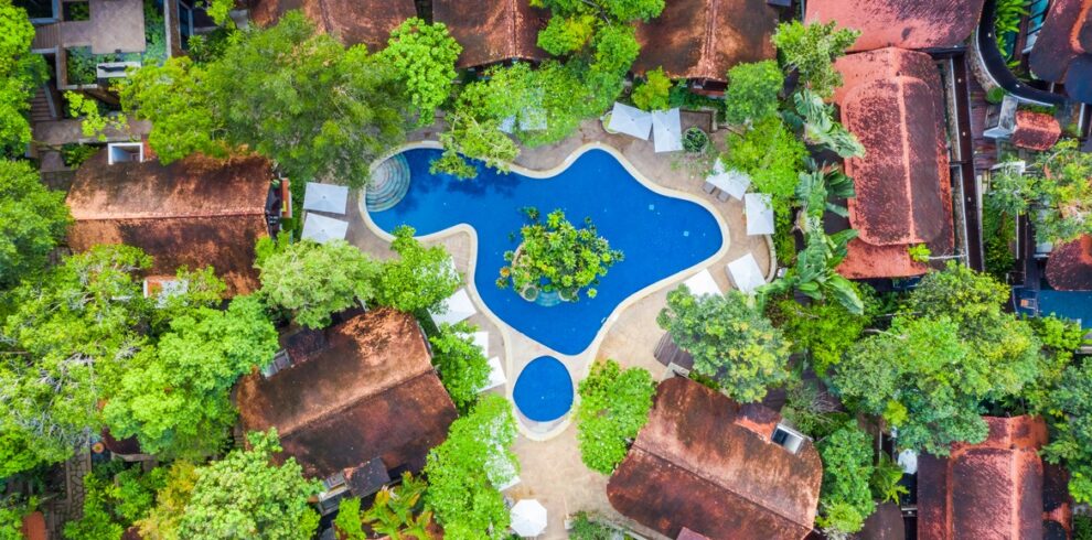 Aerial view of The Tubkaak Krabi pool surrounded by lush greenery and villas