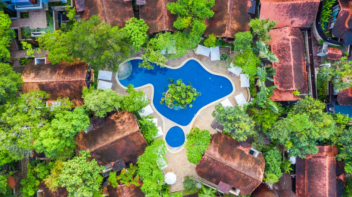 Aerial view of The Tubkaak Krabi pool surrounded by lush greenery and villas
