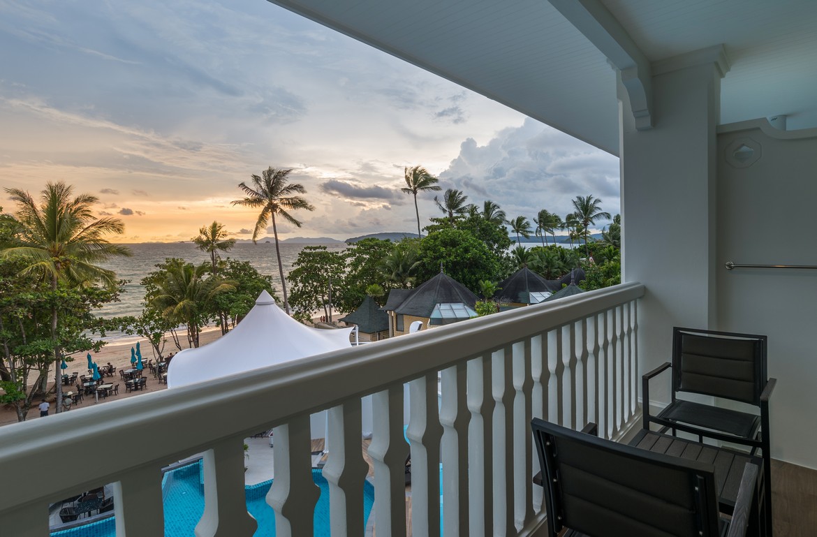 Balcony at Centara with a stunning view of the beach and palm trees