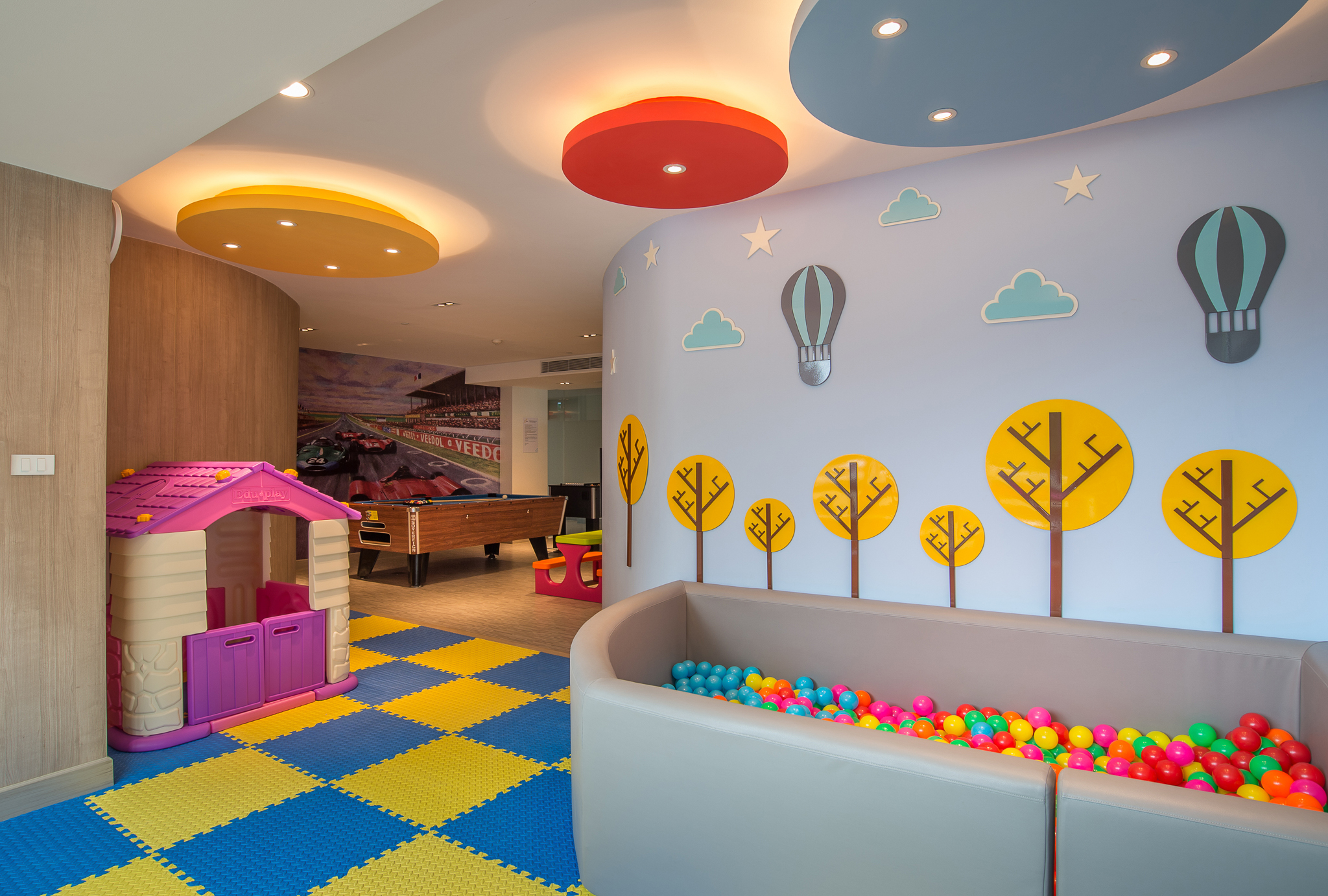 Colorful playroom at Centara with a ball pit and playhouse for kids