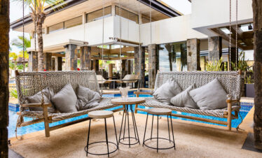 Comfortable swing seats near the pool at The Westin Turtle Bay Resort and Spa offering a relaxing retreat