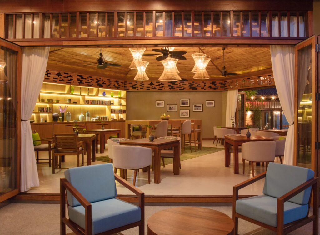 Cozy dining area at Saii Koh Samui featuring warm lighting and wooden furnishings