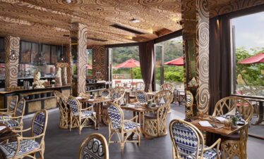 Cozy restaurant with intricate patterns on the walls and natural lighting at Keemala