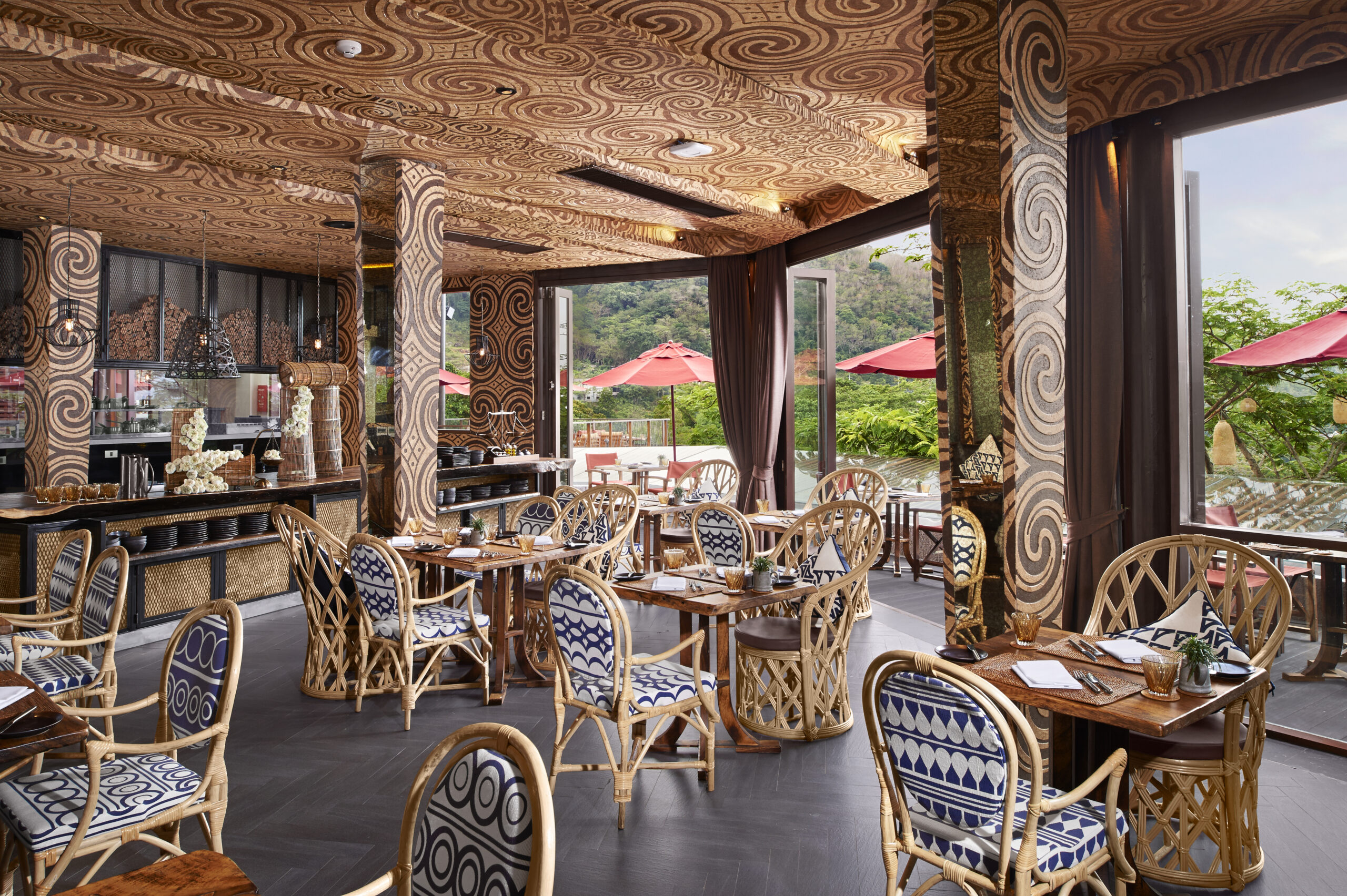 Cozy restaurant with intricate patterns on the walls and natural lighting at Keemala