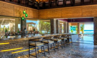 Elegant bar area at The Westin Turtle Bay Resort and Spa offering ocean views and stylish interior design