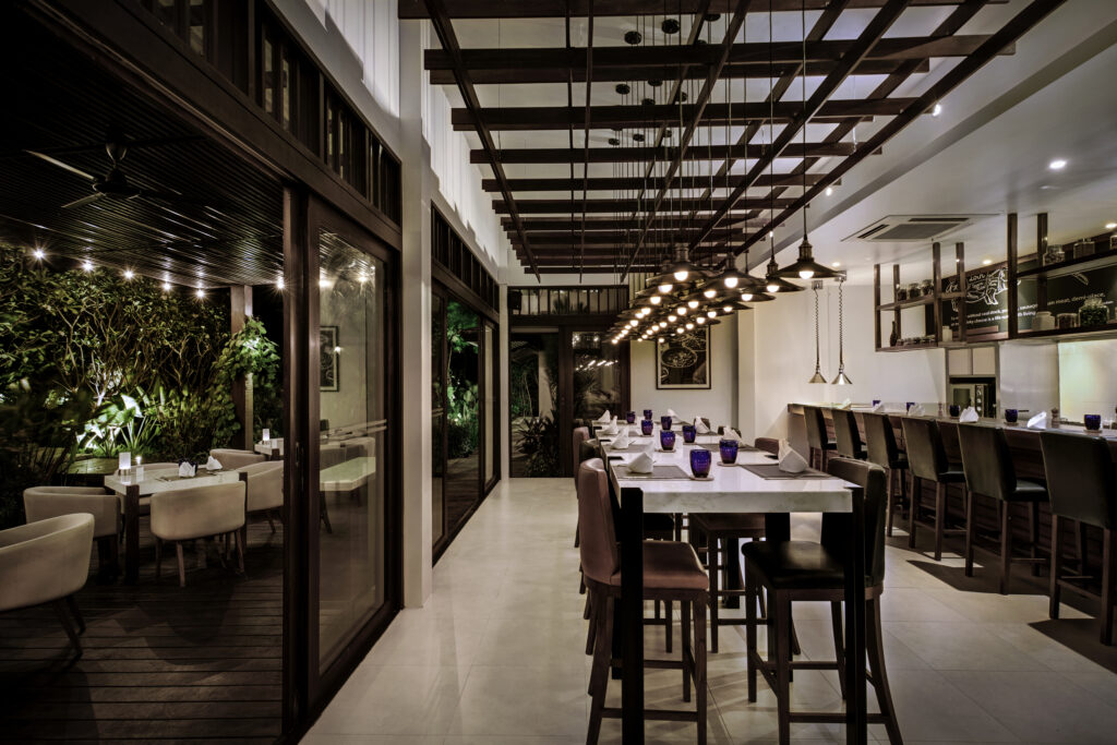 Elegant indoor dining space at Saii Koh Samui with modern decor and warm ambient lighting