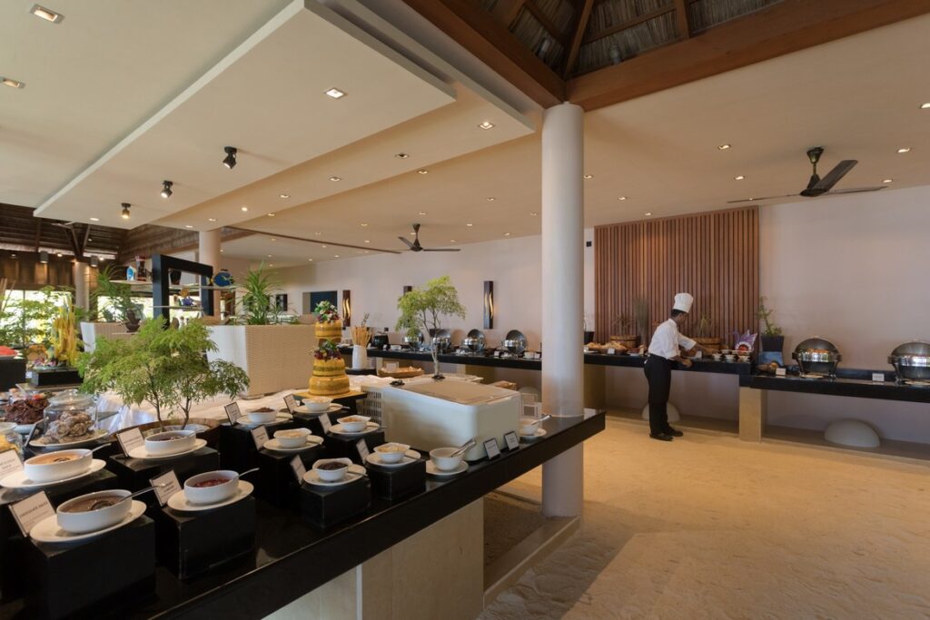 Indoor buffet with chef and wide dining spread at Veligandu