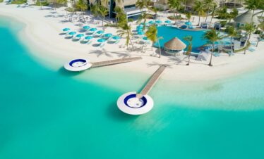 Kandima floating lounge with ocean views and white umbrella