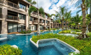 Lush greenery and connecting pools surround the rooms at La Flora Khao Lak