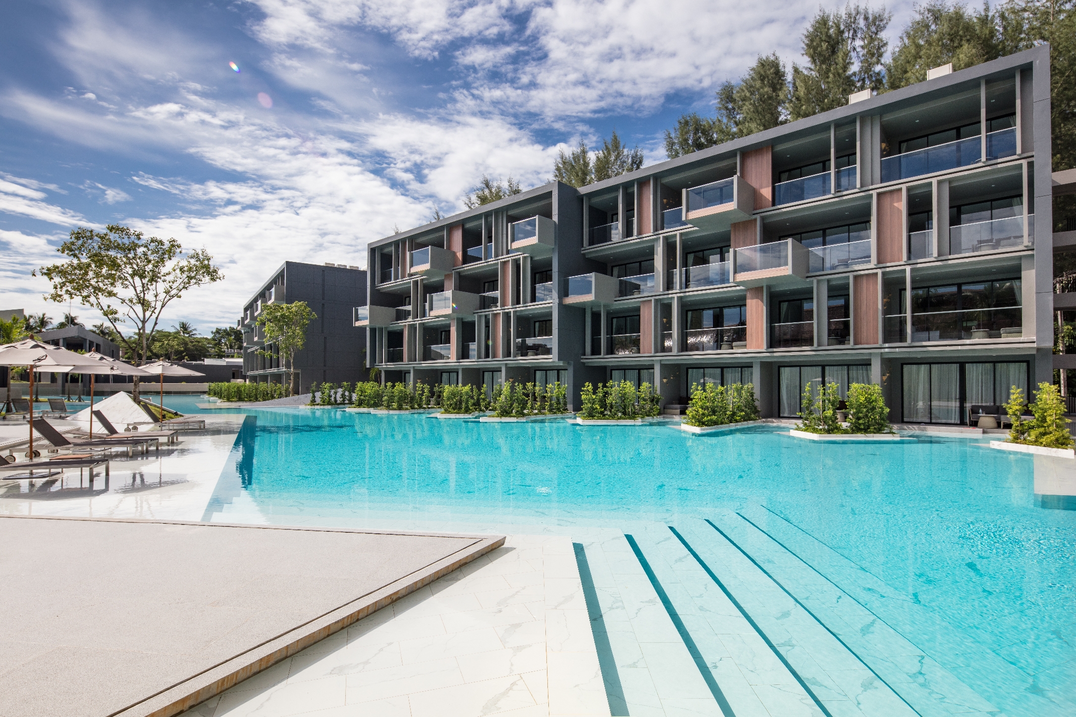 Modern architecture and pool area at La Vela Khao Lak