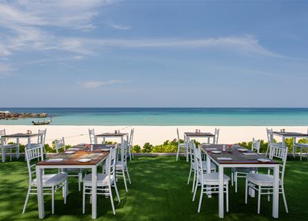 Oceanfront dining setup at Katathani with stunning beach and sea views
