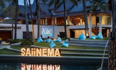 Outdoor movie night at Saii Laguna with beanbags and illuminated Saiinema sign