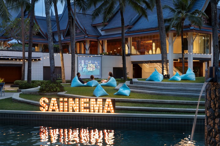 Outdoor movie night at Saii Laguna with beanbags and illuminated Saiinema sign
