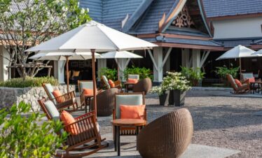 Outdoor seating area at Saii Laguna with cozy chairs and tropical decor
