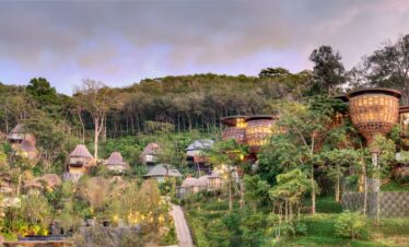 Panorama of Keemala resort featuring villas integrated into the lush hillside