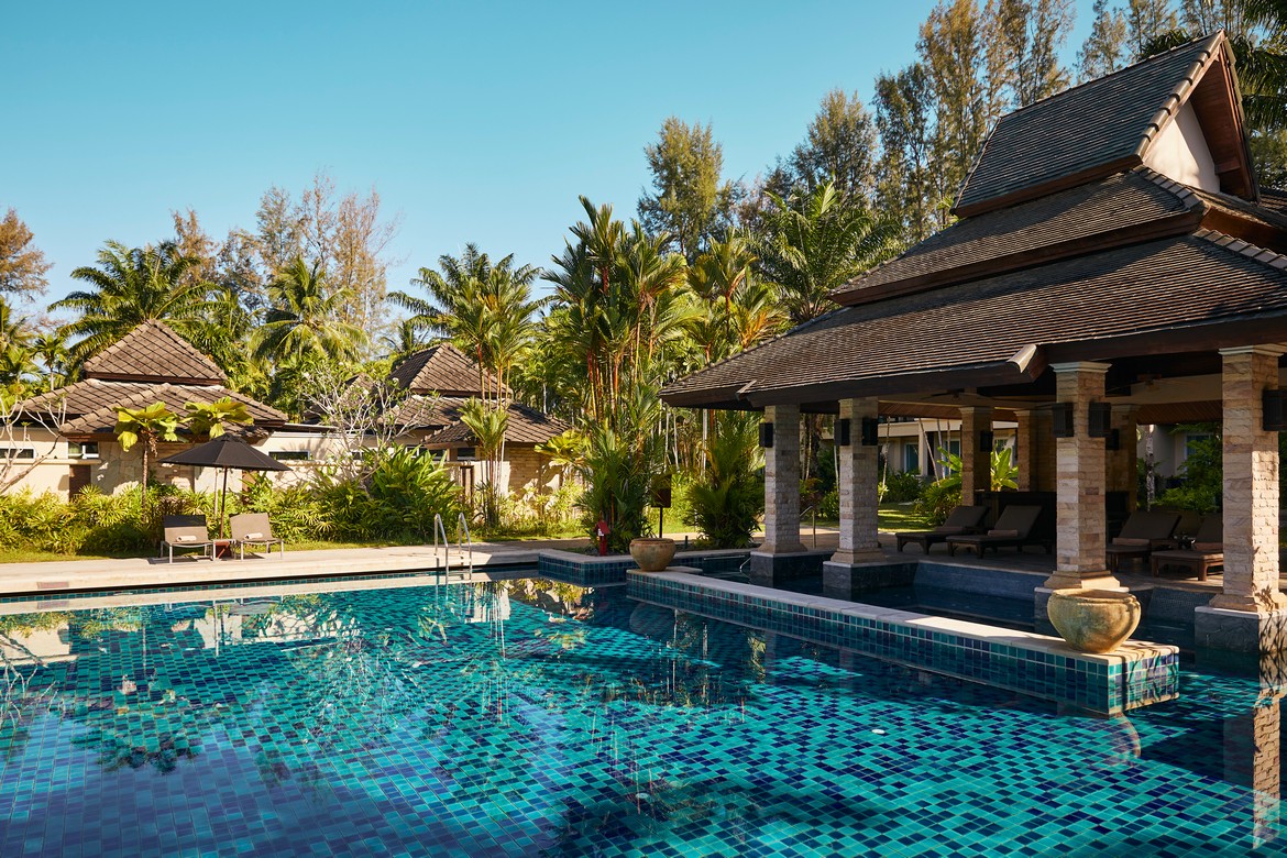 Pool area with surrounding greenery at Robinson Khao Lak