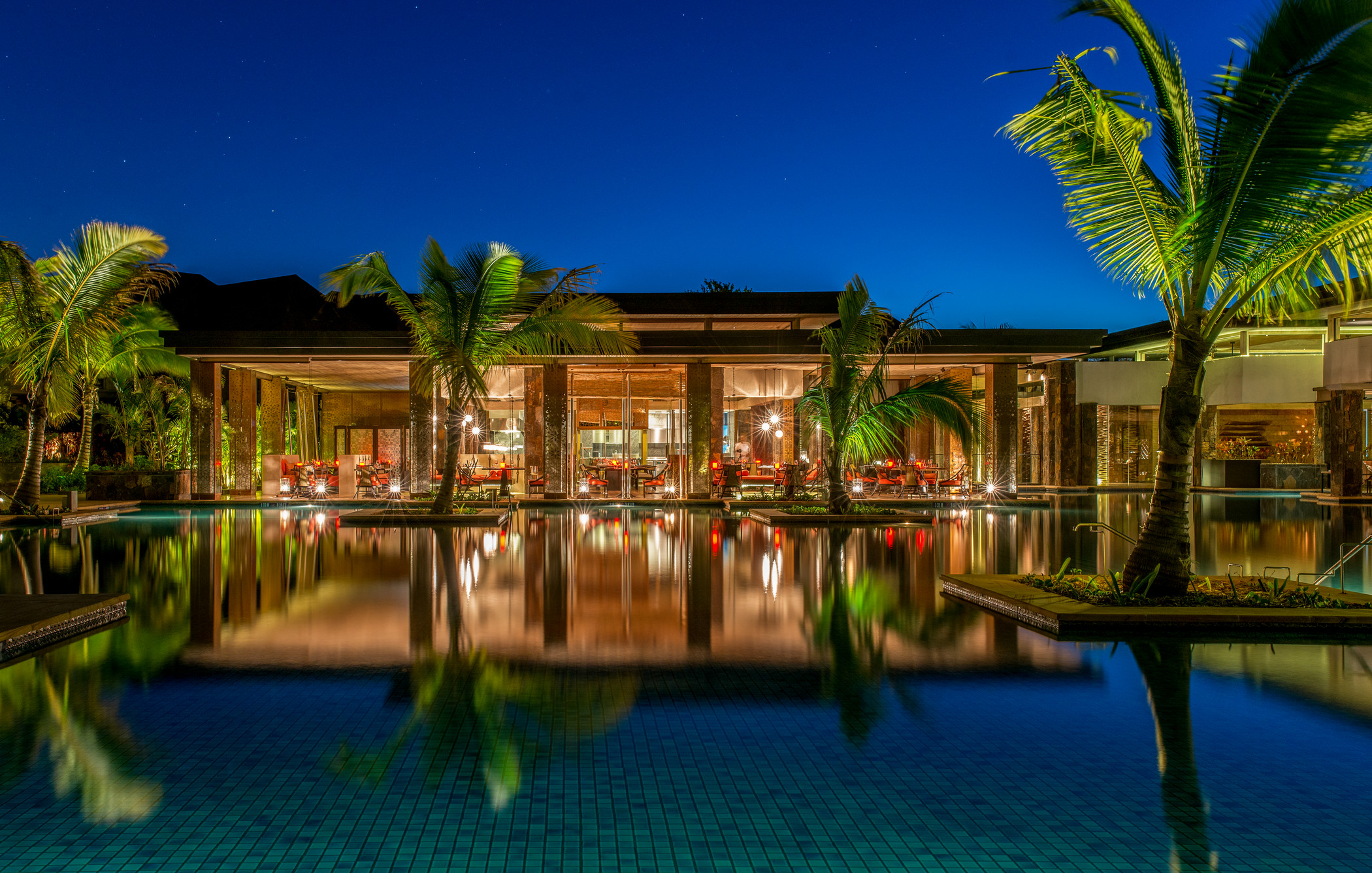 Pool scene with palm trees at The Westin Turtle Bay Resort and Spa reflecting serene resort ambiance