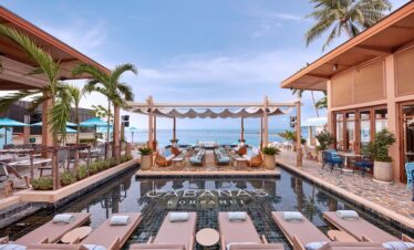 Poolside cabanas at Marasca Samui with ocean views
