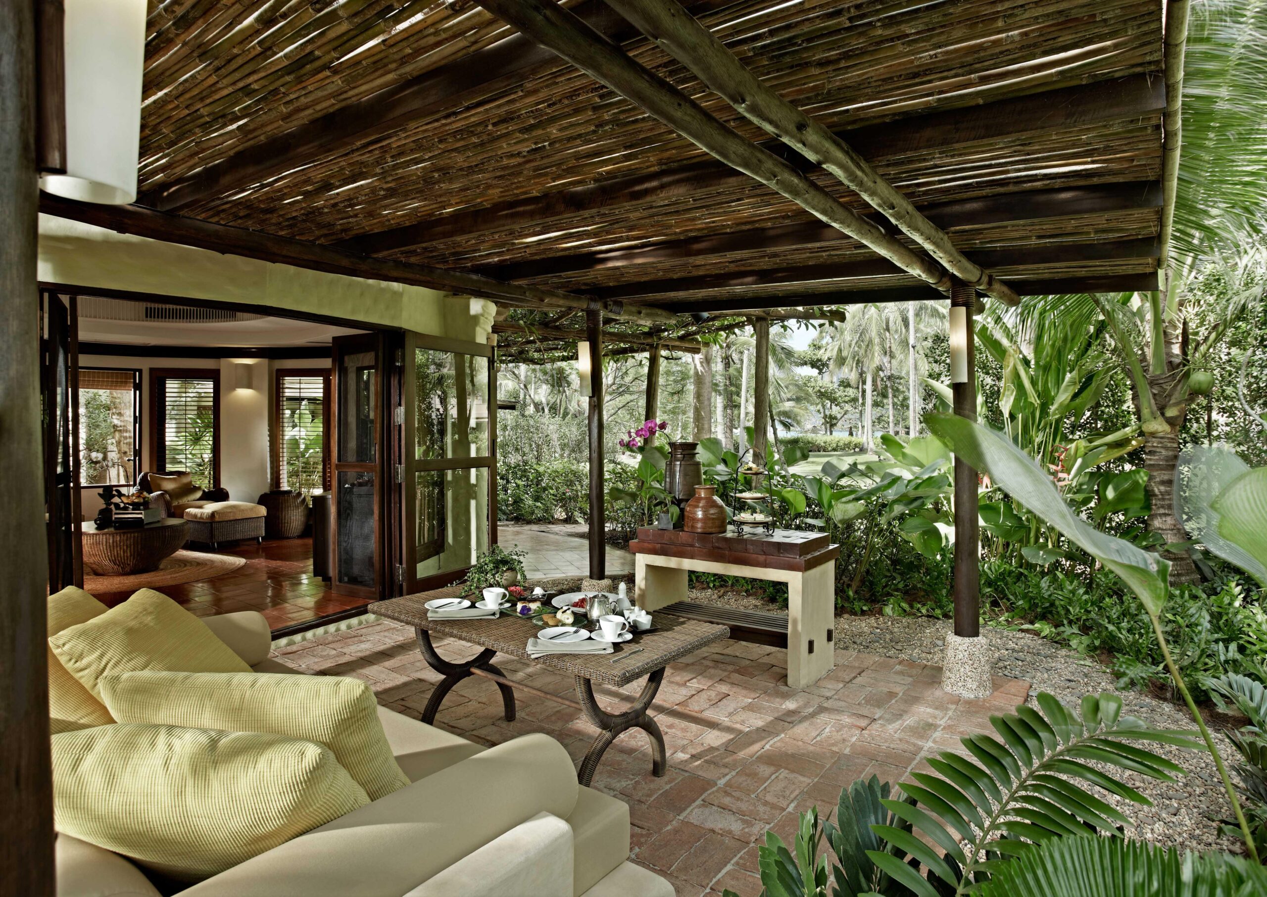 Rayavadee Krabi villa terrace with a shaded seating area surrounded by greenery