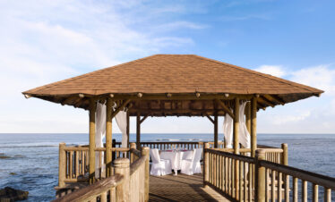 Romantic outdoor pavilion set for dining by the ocean at The Westin Turtle Bay Resort and Spa