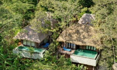 Secluded villas with thatched roofs and private pools hidden among the trees at Keemala