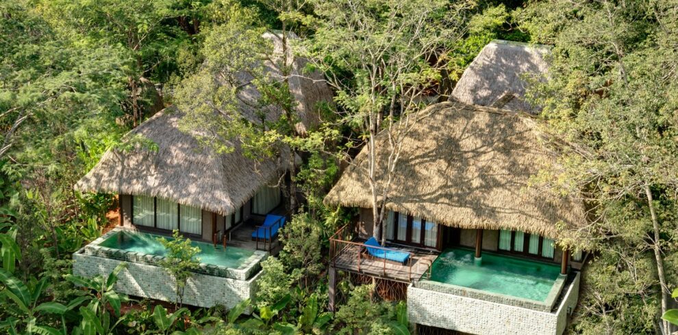 Secluded villas with thatched roofs and private pools hidden among the trees at Keemala
