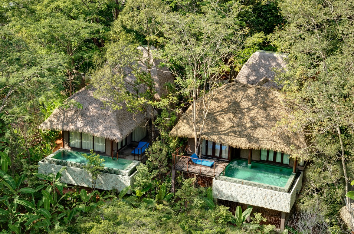 Secluded villas with thatched roofs and private pools hidden among the trees at Keemala