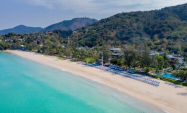 Serene aerial view of Katathani beach with lush green hills and clear waters