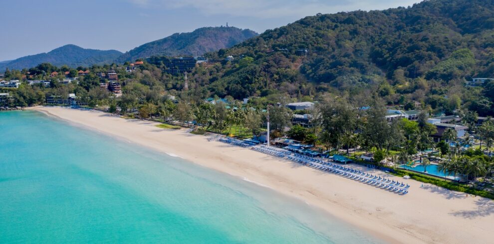 Serene aerial view of Katathani beach with lush green hills and clear waters