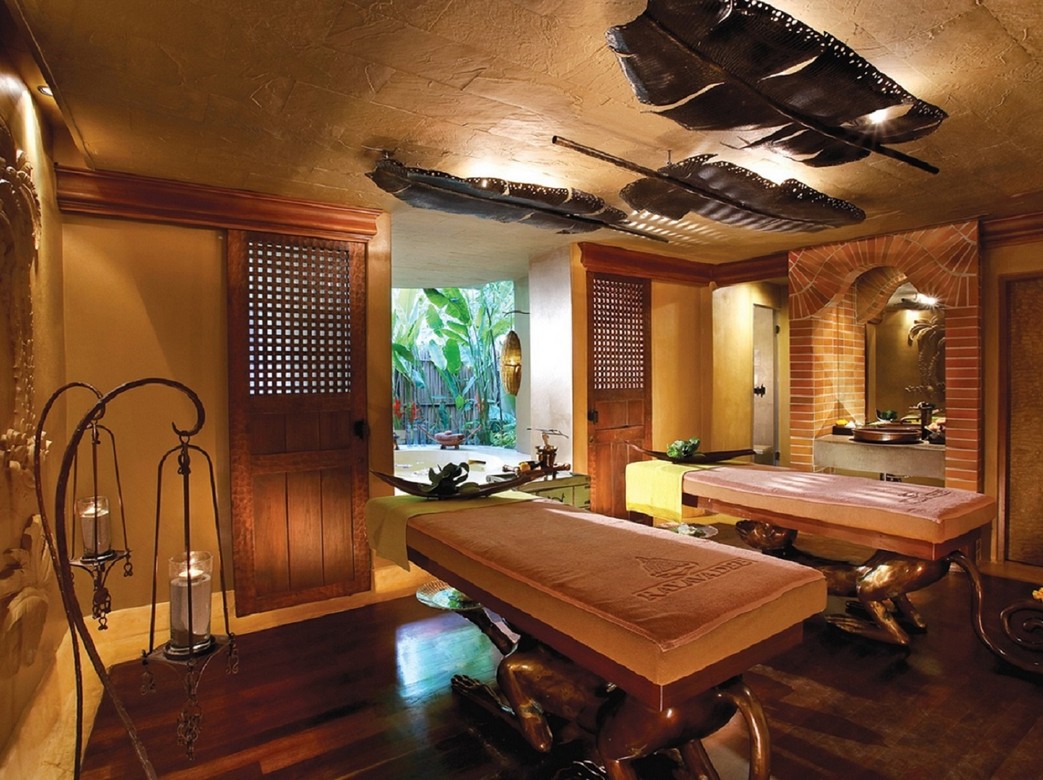 Spa room at Rayavadee Krabi featuring two massage tables