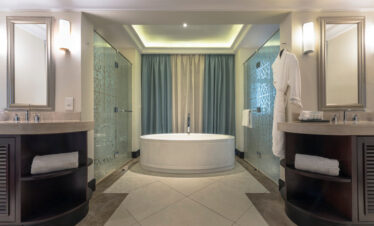 Spacious modern bathroom with a soaking tub at The Westin Turtle Bay Resort and Spa designed for relaxation