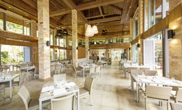 Spacious restaurant interior with high ceilings at Robinson Khao Lak