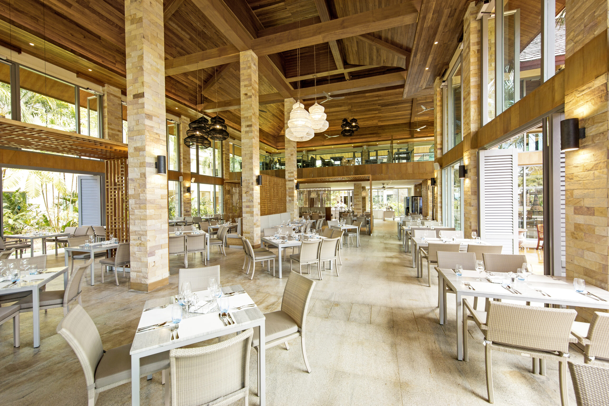 Spacious restaurant interior with high ceilings at Robinson Khao Lak