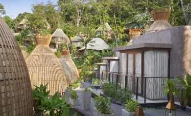 Unique clay cottages surrounded by tropical plants in the heart of Keemala resort