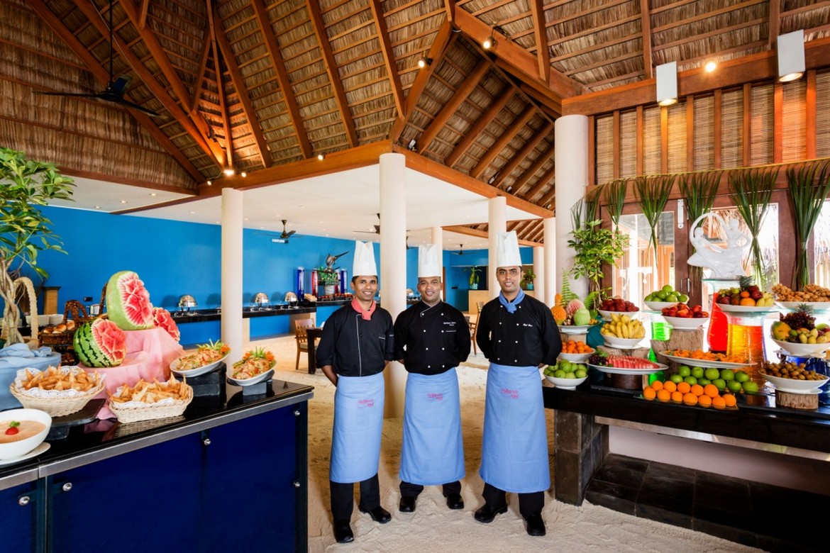 Veligandu chefs at buffet with colorful tropical fruit display