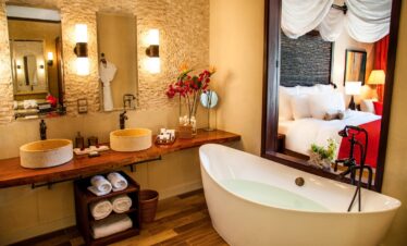 A luxurious bathroom with a modern design featuring a large bathtub and dual sinks Story of comfort and relaxation