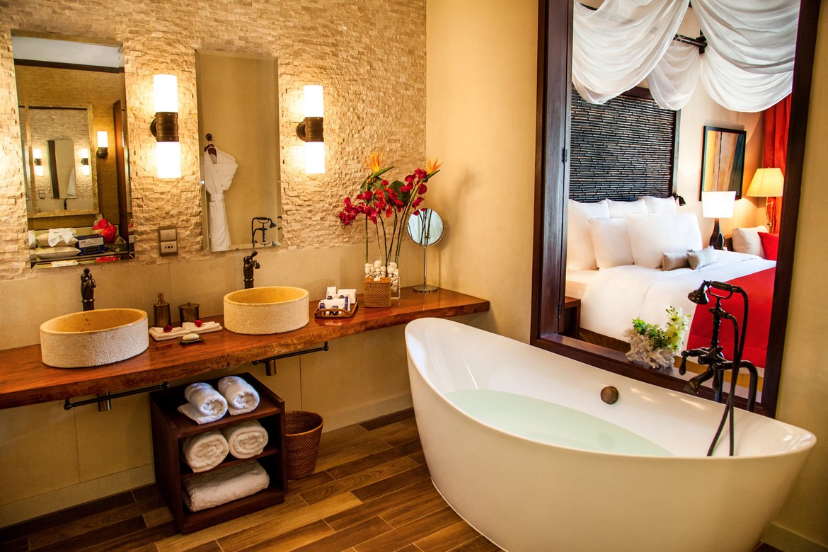A luxurious bathroom with a modern design featuring a large bathtub and dual sinks Story of comfort and relaxation