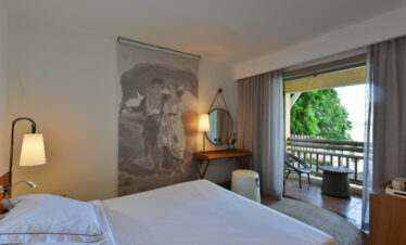A serene room with a view of the balcony at Veranda Paul & Virginie