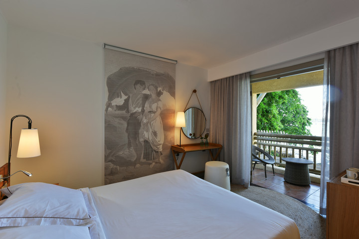 A serene room with a view of the balcony at Veranda Paul & Virginie